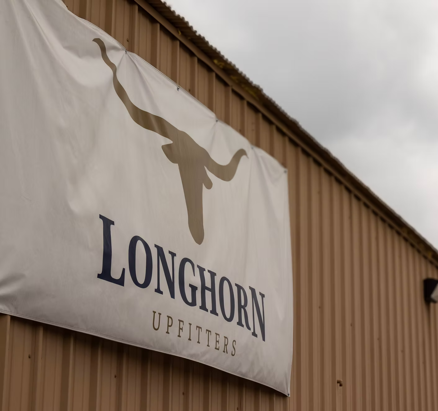 Longhorn Upfitters sign on building - DFW truck upfitting experts